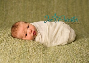 Awake Newborn Breastfeeding Baby Boy MI Portraits 300x214