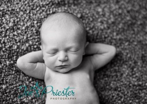 Posed Newborn Portrait Relaxing Blanket 300x214
