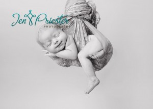 Newborn Hanging Shot Smiling Baby Girl Midland Mi Newborn Photography 300x214