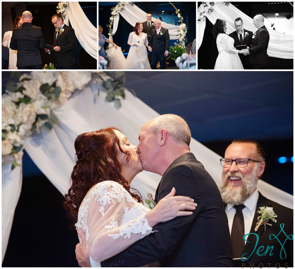 a bride and groom just married and having the first kiss